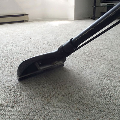 Carpet cleaning wand on residential carpet.